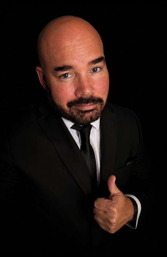 kp kelly in black suit in chicago
